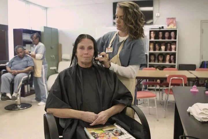 Lowell inmates say the cosmetology program is a refuge from prison life.