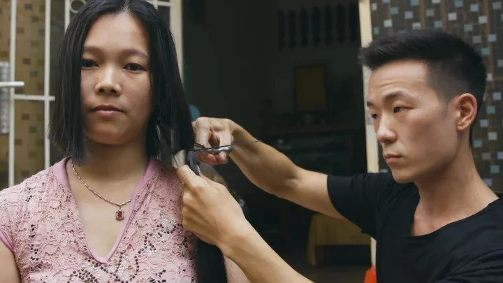 CHOI TRAVELS FROM VILLAGE TO VILLAGE CUTTING HAIR, OFFERING 30 TIMES THE AMOUNT HIS COMPETITORS PAY.