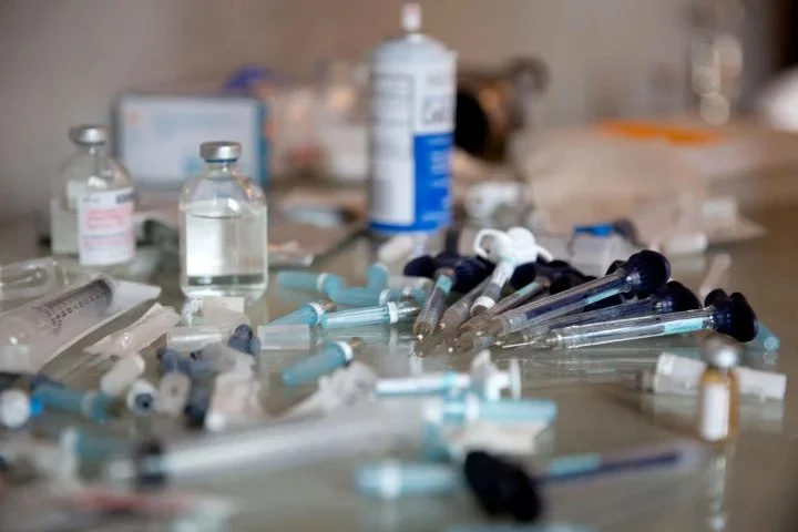 Dr. Maercks unpacks his tools in a high-end hotel room in New York City.