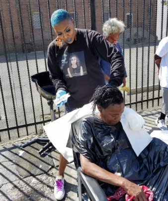 PHOTO COURTESY: SHIRLEY RAINES Raines uses camping and salon equipment to do hair without a water source.