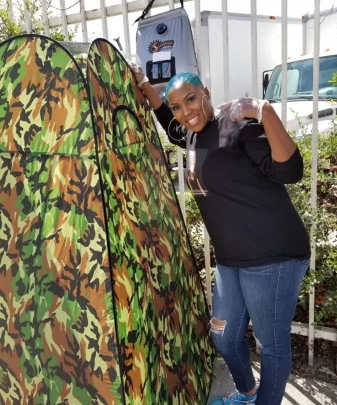 PHOTO COURTESY: SHIRLEY RAINES. A camping shower allows Raines to help individuals with disabilities who have difficulty reaching a shelter.