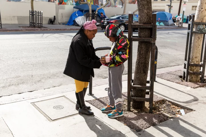 PHOTO BY REFINERY29 Michelle Parker's youngest daughter visits her at her one-room apartment on Skid Row.