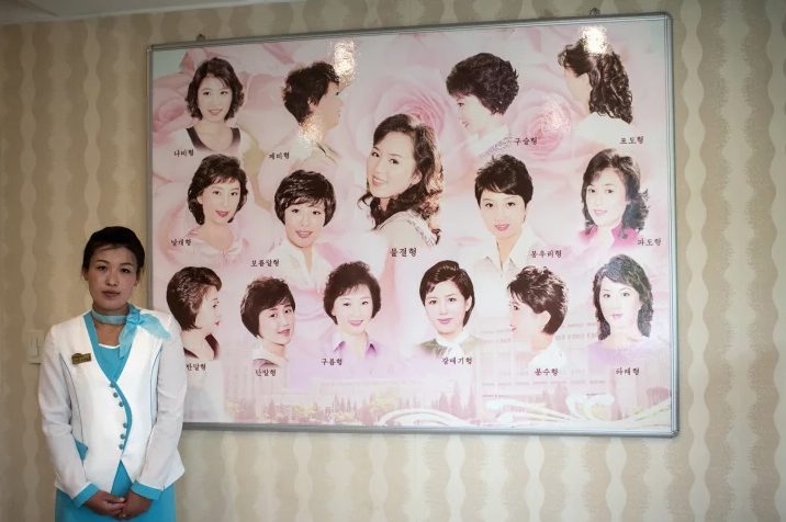 CARL COURT/GETTY IMAGES North Korean hair salons advertise the styles approved by Kim Jong-un.