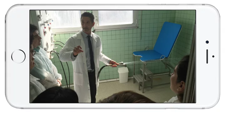 Thermal center manager Rachid Ainouche demonstrates a hydrotherapy treatment to a room of visiting dermatologists.