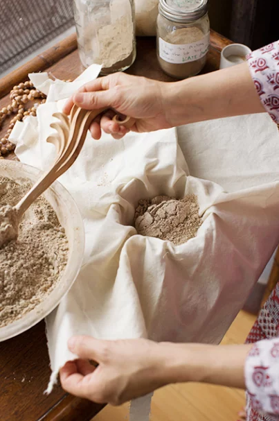 A CUSTOME MIXTUR EOF HERBS BEING LOADED INTO A BOLSA. / PHOTO: COURTESY OF SURYA.